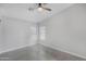 Bright bedroom features neutral color palette, tile floors, and ceiling fan at 23829 N 36Th Dr, Glendale, AZ 85310