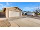 Detached garage with a wide driveway and minimalist landscaping at 23829 N 36Th Dr, Glendale, AZ 85310