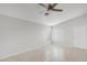 Living room with tile flooring, ceiling fan, a vaulted ceiling, and a new door at 23829 N 36Th Dr, Glendale, AZ 85310