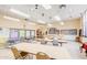 Spacious activity room with tables, chairs, and bright lighting for community events at 2757 Leisure World --, Mesa, AZ 85206