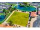Overhead view of community amenities featuring a green lawn bowling area and surrounding ponds with fountains at 2757 Leisure World --, Mesa, AZ 85206