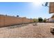Spacious backyard area with desert landscaping and a privacy wall creating a serene outdoor space at 2757 Leisure World --, Mesa, AZ 85206