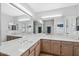 Bathroom offering a double vanity and large mirror at 2757 Leisure World --, Mesa, AZ 85206