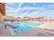 Exterior view of a pool featuring lap lanes, lounge chairs, and shade structures at 2757 Leisure World --, Mesa, AZ 85206