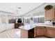 Eat-in kitchen features a breakfast bar and multiple windows offering ample sunlight and backyard views at 2757 Leisure World --, Mesa, AZ 85206