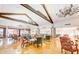 Spacious lounge area with chandeliers, high ceilings, wood beams, and hardwood floors at 2757 Leisure World --, Mesa, AZ 85206