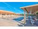 Outdoor shuffleboard courts with covered seating areas and building in background at 2757 Leisure World --, Mesa, AZ 85206