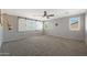 A bright bedroom with soft carpet flooring, neutral walls, and multiple windows for ample light at 29706 N 127Th Ln, Peoria, AZ 85383