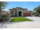 Beautiful two-story home with terracotta roof, a manicured lawn, and spacious driveway at 29706 N 127Th Ln, Peoria, AZ 85383