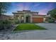 Beautiful stucco two-story home featuring a two-car garage and a well-manicured yard under a stunning sky at 29706 N 127Th Ln, Peoria, AZ 85383