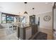 Spacious kitchen featuring a center island, stainless steel appliances, and an adjacent dining area at 29706 N 127Th Ln, Peoria, AZ 85383