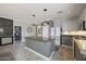 Bright kitchen with a large central island, stainless steel appliances, and modern design at 29706 N 127Th Ln, Peoria, AZ 85383