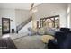 Spacious living room with modern staircase, brick accent wall, and views to the kitchen at 29706 N 127Th Ln, Peoria, AZ 85383
