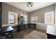 Cozy home office with built-in desks, natural light, and stylish decor for a productive workspace at 29706 N 127Th Ln, Peoria, AZ 85383