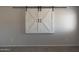 A close up of a window, featuring the closed white barn door shutters at 29706 N 127Th Ln, Peoria, AZ 85383