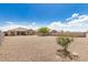 Large backyard with desert landscaping and block fence, perfect for entertaining at 30208 W Fairmount Ave, Buckeye, AZ 85396