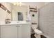 Bright bathroom with stylish decor, featuring a vanity and decorative striped shower curtain at 30208 W Fairmount Ave, Buckeye, AZ 85396