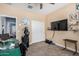 Comfortable bedroom featuring carpet, TV, and a closet with sliding doors at 30208 W Fairmount Ave, Buckeye, AZ 85396