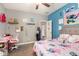 Charming bedroom with a cozy atmosphere, study desk, and colorful decorations on the walls at 30208 W Fairmount Ave, Buckeye, AZ 85396