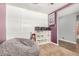 Cozy room with a large beanbag chair, built-in shelving, and soft carpet at 30208 W Fairmount Ave, Buckeye, AZ 85396