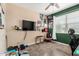 Relaxing bedroom with window view, ceiling fan, neutral tones, and a wall-mounted television at 30208 W Fairmount Ave, Buckeye, AZ 85396