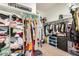 Spacious walk-in closet with ample shelving and hanging space for organized storage at 30208 W Fairmount Ave, Buckeye, AZ 85396