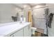 Bathroom with a large mirror and walk-in shower at 30213 W Fairmount Ave, Buckeye, AZ 85396