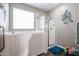 Bright bathroom featuring walk-in tub and separate glass shower stall with grab bars at 30213 W Fairmount Ave, Buckeye, AZ 85396