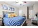 Bedroom with a large bed and neutral carpet at 30213 W Fairmount Ave, Buckeye, AZ 85396
