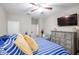Comfortable bedroom featuring a ceiling fan, dresser, and a serene atmosphere at 30213 W Fairmount Ave, Buckeye, AZ 85396