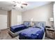 Inviting bedroom with two twin beds, soft lighting, and comfortable decor elements at 30213 W Fairmount Ave, Buckeye, AZ 85396
