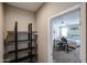 View through doorway of a Primary bedroom featuring a work space and large bed at 30213 W Fairmount Ave, Buckeye, AZ 85396