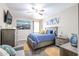Cozy bedroom with a ceiling fan and TV at 30213 W Fairmount Ave, Buckeye, AZ 85396