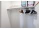 Functional closet space with ample shelf storage and a hanging rod for organized clothing at 30213 W Fairmount Ave, Buckeye, AZ 85396
