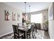 This dining room features stylish decor, a modern light fixture, and a patterned rug at 30213 W Fairmount Ave, Buckeye, AZ 85396