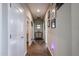Hallway with wood-look floors and neutral paint at 30213 W Fairmount Ave, Buckeye, AZ 85396