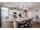 Modern kitchen with granite countertops, stainless steel appliances, and a large island at 30213 W Fairmount Ave, Buckeye, AZ 85396