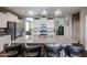 Modern kitchen with granite countertops, stainless steel appliances, and a large island at 30213 W Fairmount Ave, Buckeye, AZ 85396