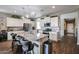 Modern kitchen with granite countertops, stainless steel appliances, and a large island at 30213 W Fairmount Ave, Buckeye, AZ 85396