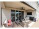 Relaxing covered patio area with plush seating near the sparkling pool at 30213 W Fairmount Ave, Buckeye, AZ 85396