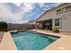 Inviting backyard pool with a blue-tiled border and beige concrete deck offers a refreshing outdoor retreat at 30213 W Fairmount Ave, Buckeye, AZ 85396