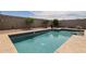 Private backyard pool with desert landscaping featuring cool refreshing water at 30213 W Fairmount Ave, Buckeye, AZ 85396