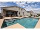 Enjoy the cool, sparkling water of the in-ground pool and adjacent patio in this inviting backyard oasis at 30213 W Fairmount Ave, Buckeye, AZ 85396