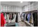 Spacious walk-in closet with ample shelving and hanging space for organizing clothes at 30213 W Fairmount Ave, Buckeye, AZ 85396