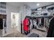Well-organized walk-in closet with shelves, rods, and access to other areas at 30213 W Fairmount Ave, Buckeye, AZ 85396