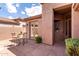 Backyard patio with dining set and view of building exterior at 32627 N 70Th St, Scottsdale, AZ 85266