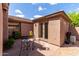 Backyard patio with dining set and a view of the home's exterior at 32627 N 70Th St, Scottsdale, AZ 85266
