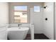 Bathroom boasts a freestanding tub, a tiled shower, and sleek design at 32627 N 70Th St, Scottsdale, AZ 85266