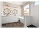 Bathroom with a soaking tub, dual sinks, and modern fixtures at 32627 N 70Th St, Scottsdale, AZ 85266
