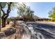 Stunning view of the community clubhouse surrounded by desert landscaping, offering a welcoming and luxurious ambiance at 32627 N 70Th St, Scottsdale, AZ 85266
